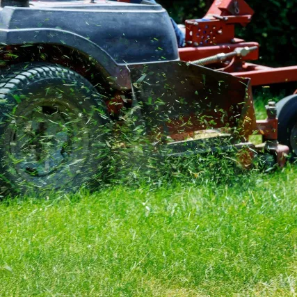 Red Mower Cutting Lawn